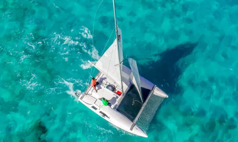 top view of sea wind catamaran over the blue sea