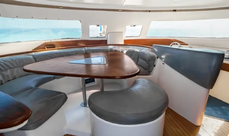 soft cushion and wooden table inside morrocoy catamaran