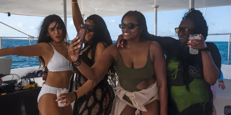Drinking and dancing in a catamaran party