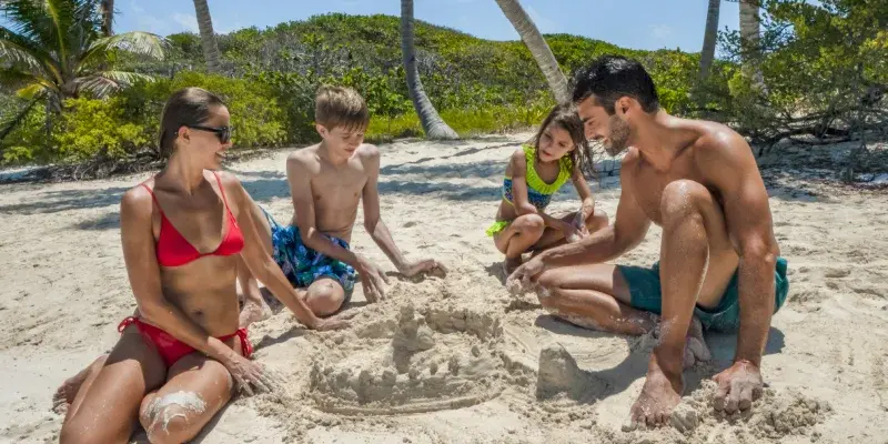 family in isla contoy building a sancastle